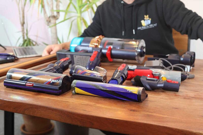 Dyson Gen5detect accessories laid on table.